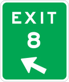 A green sign with text Exit, the number 8 and an arrow pointing to the upper left.