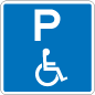 A blue and white sign with a P at the top and a stylised image of a person in a wheelchair below.