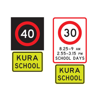 Two school speed signs, both with a speed limit at the top and a yellow and black sign reading kura school at the bottom. The right sign has hours listed as well as the speed limit.