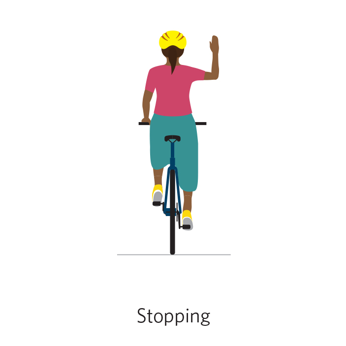 A person on a bicycle bends their right arm and points their hand up in a stop signal.