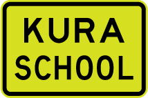 A rectangular yellow sign with a black border and text reading kura school.