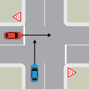 A blue car is travelling straight through a 4-way intersection. A red car is approaching from the left on the intersecting road. The red car is behind a give way sign and white line.