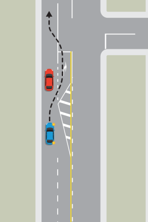 The blue car behind red car is planning to overtake the red car using the right turn bay