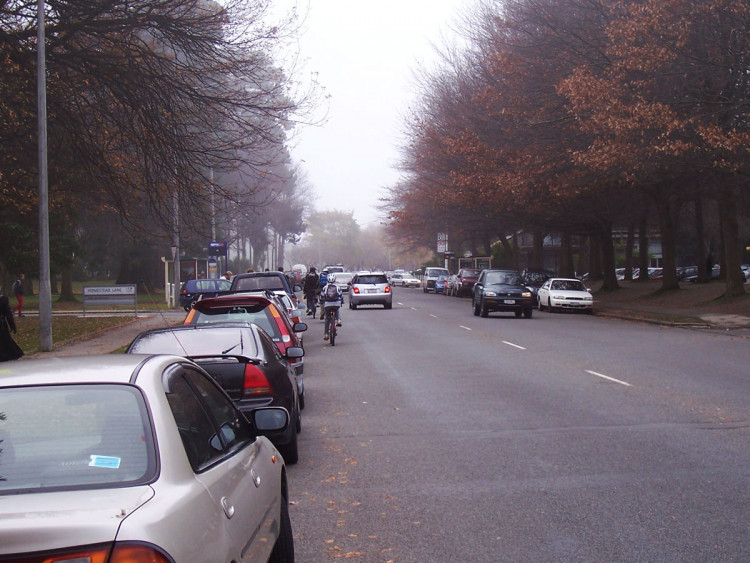 ilam road before separation devices, cars parked along kerb