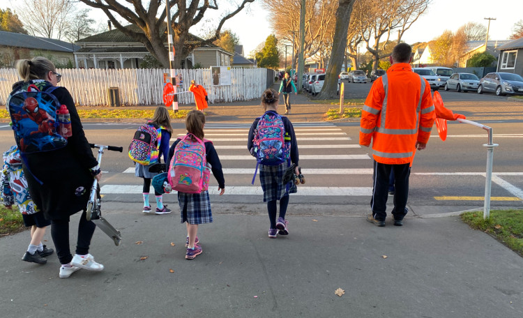 a photo showing a school patrolled zebra crossing without a median