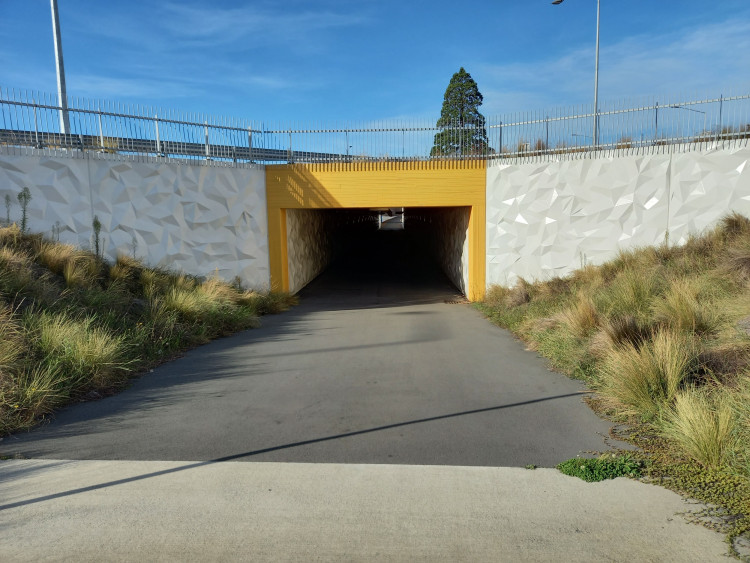 a photo showing a pathway underpass
