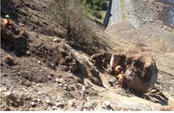 The Abseil Access team work on a 50 tonne boulder 