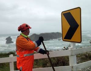 Richard Hawes, carpenter for Westreef, installing one of 200 arrow signs.
