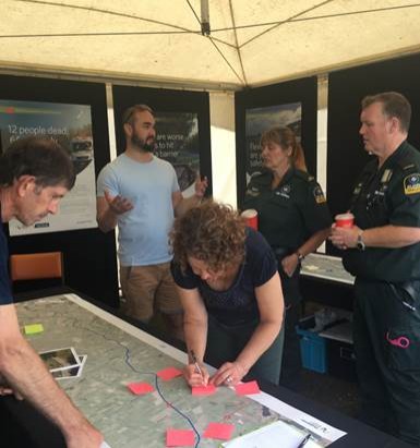 Safe Roads project team meeting with locals including St John Ambulance staff at