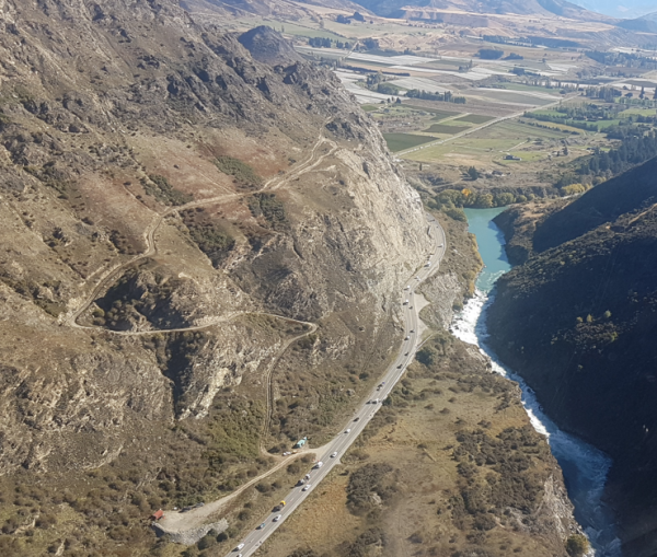 Aerial view over Nevis Bluff with road alongside Kawarau River.