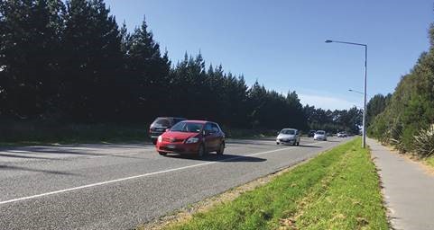 Shows no centreline safety barrier on QEII Drive, Christchurch