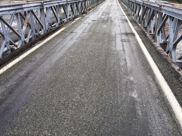 The worn condition of the Waiho River Bailey Bridge deck