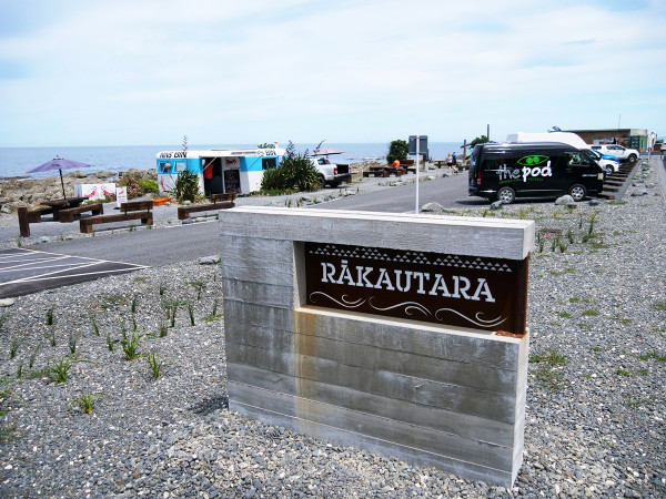 Rakautara sign at a safe stopping area on a beach area