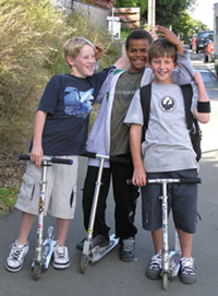Boys with scooters.
