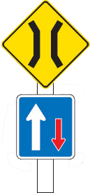 A white pole with a yellow diamond sign with a black border and a black stylised bridge in the centre. A rectangular blue sign with a white border and a larger white arrow pointing up and a smaller red arrow pointing down.