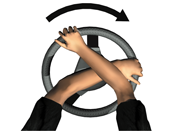 Steering wheel, hands are grasping the wheel with right hand crossed over left. Arrow shows wheel is being turned to the right.